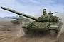 Box art illustration of two Russian T-72B1 tanks with reactive armor moving across a dusty desert landscape.