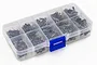 A clear plastic storage case containing various black metal screws, each compartment holding screws in small plastic bags.