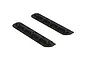 Two black ARRMA centre chassis skid plates shown from an isometric angle against a white background.