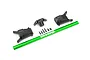 Traxxas green aluminium chassis brace, three black plastic mounting components, and six small black screws arranged on a white background.