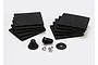 A Traxxas Spartan miscellaneous parts set including two stacks of adhesive foam pads, plastic mounts, and small metal screws on a white background.