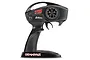 A black Traxxas TQ 2.4GHz 2-channel pistol-grip RC transmitter with a steering wheel and throttle trigger on a white background.