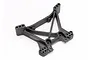 A black plastic rear shock tower for a Traxxas RC vehicle, featuring multiple mounting holes for suspension adjustment.