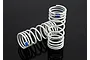 Two white Traxxas RC shock springs with blue identification marks on a black reflective surface.