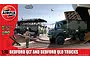 Airfix 1/76 scale Bedford QLT and QLD military truck model kit box art featuring illustrations of the trucks on a beach landing scene.