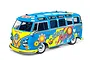 A 1/10 scale Tamiya RC Volkswagen Type 2 van model with a bright blue and yellow Flower Power paint scheme featuring peace signs and floral decals.