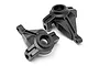 Two black plastic RC steering hubs for Maverick RC vehicles, shown from an angled perspective against a white background.