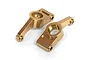 Two gold-anodized aluminium RC car rear hubs on a white background.
