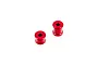 Two red anodized aluminium chassis brace spacers for ARRMA RC vehicles, shown from a high angle against a white background.
