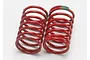 Two red Traxxas 1/16 GTR shock springs with green markings on a white background.