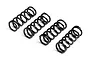 Four black metal coil springs for RC car bumpers arranged in a row on a white background.