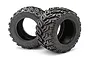 Two black rubber RC monster truck tyres with aggressive tractor-style tread patterns, featuring Tredz branding on the sidewalls.