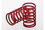 Two red Traxxas shock springs with pink identification markings on a white background.