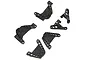 A set of five black molded plastic RC shock towers and panhard mounts arranged on a white background.