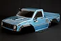 A pre-painted glacier blue HSP Pioneer RC truck body shell on a black background with black fender flares and side mirrors.