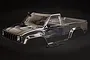 A clear, unpainted 1/10 scale RC truck body shell for the HSP Pioneer, shown against a black background with separate black plastic accessories.