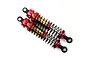 Two Yeah Racing 90mm big bore RC shock absorbers with red aluminium caps and collars, gold bodies, and black springs against a white background.