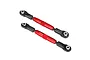 Two Traxxas red anodized aluminium turnbuckles with black plastic rod ends on a white background.
