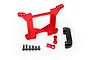 Traxxas red aluminium rear shock tower set including mounting hardware and a black plastic component on a white background.