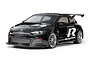 A studio shot of a black Tamiya Volkswagen Scirocco GT RC touring car model on a white background.