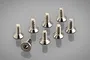 A set of eight silver-coloured metal countersunk head screws with hexagonal drive sockets arranged on a reflective grey surface.