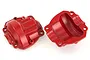 Two red anodized aluminium portal axle covers for an RC car, shown from both the exterior and interior sides against a white background.