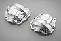 Two silver-coloured aluminium portal axle covers for an RC vehicle, shown from an angled perspective on a grey background.