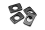 Four black rectangular metal steering nuts for RC cars arranged on a white background.