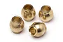 Four small brass shock pivot balls for RC cars arranged on a white background.