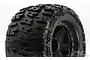 A close-up of a Pro-Line 3.8 inch Trencher tyre mounted on a black Raid rim, showing the aggressive tread pattern and wheel design.