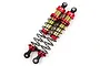 Two Yeah Racing red and gold aluminium big bore RC shock absorbers with black springs on a white background.