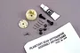 Traxxas 2388 planetary differential gear set including plastic housing, metal gears, pins, screws, grease tube, and instruction manual.