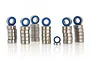 A collection of metal ball bearings with blue rubber seals arranged in several small stacks against a white background.