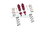 A set of two red anodized aluminium RC shock absorbers with extra springs and mounting hardware on a white background.