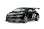A studio shot of a black Tamiya Volkswagen Scirocco GT RC touring car model on a white background.
