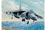 An artistic illustration of an AV-8B Harrier II jet fighter in flight above an aircraft carrier deck at sea.