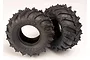 Two black Traxxas Sledgehammer RC monster truck tyres with aggressive tread patterns, shown against a plain white background.