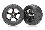 Two Traxxas 2.2 inch Anaconda rear buggy tyres pre-glued onto black chrome Tracer wheels, shown against a white background.