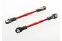 Two Traxxas red anodized aluminium turnbuckles with black plastic rod ends against a white background.