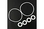 A set of six white O-rings of varying sizes arranged on a black textured surface.