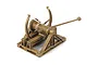 A studio shot of an assembled Academy da Vinci Series catapult model kit featuring a brown, wood-textured plastic finish with white technical line overlays.