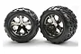Two Traxxas 2.8 inch Talon tires pre-mounted on black chrome All-Star wheels, viewed from the front against a white background.
