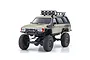 Kyosho Mini-Z Toyota 4Runner Hilux Surf RC rock crawler in quick sand colour, featuring a roof rack with lights and off-road tires.