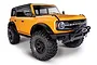 A studio shot of a bright orange Traxxas TRX-4 2021 Ford Bronco RC rock crawler on a white background.