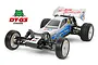 A Tamiya Neo Fighter Buggy RC car on a white background, featuring a white and blue body, rear wing with text, and off-road tires.