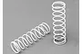 Two white coil springs for RC car shock absorbers positioned on a grey surface.
