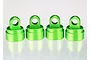 Four bright green anodized aluminium shock caps for Traxxas RC vehicles, arranged in a row against a white background.