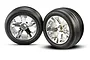 Two Traxxas 2.8-inch ribbed tires pre-glued onto chrome-finished All-Star five-spoke wheels, shown against a white background.