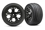 Two Traxxas 2.8 inch ribbed tires mounted on black chrome All-Star rims, shown from front and angled perspectives.
