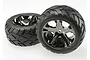 Two Traxxas 2.8 inch Anaconda tires pre-glued onto black chrome All-Star rims, shown against a plain white background.